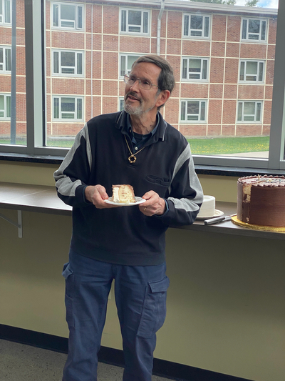 Alex with his retirement cake Alex with his retirement cake